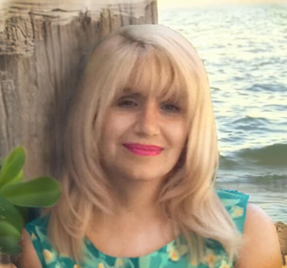 A photo of Dr. Stonbely in a tropical environment